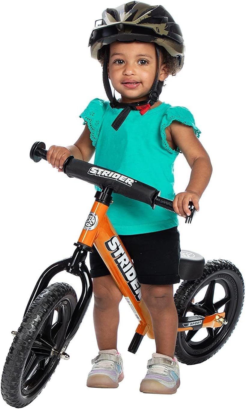 Strider 12” Sport Bike - No Pedal Balance Bicycle for Kids 1 to 4 Years - Includes Safety Pad, Padded Seat, Mini Grips & Flat-Free Tires - Tool-Free Assembly & Adjustments